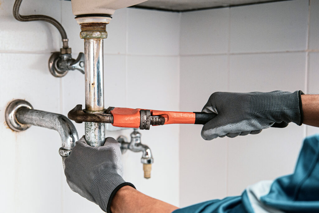 Expert plumber repairing bathroom leaks in Orange County and nearby